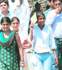  Voters at a polling centre in Zirakpur. 