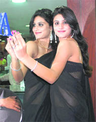 A fashion model exhibits diamonds at a store in Ludhiana on Wednesday