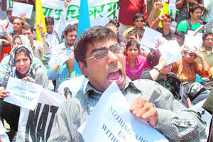 Differently abled persons during a protest against the non-inclusion of disabled persons in a panel formed to draft the New Disability Act, in New Delhi on Wednesday.
