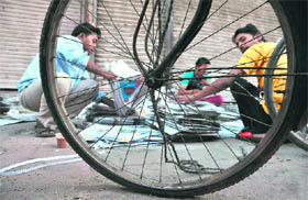  Newspaper vendors at work on an early summer morning in Ludhiana