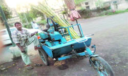 A three-wheeler Jugaad being used by a sugarcane juice vendor. 