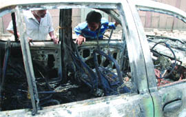 The Indica car which caught sudden fire near Lady Hardinge Hospital in New Delhi on Thursday.