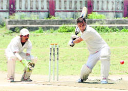 A batsman plays a shot in the Second Basudev Memorial Cricket Tournament at Survey Grounds in Dehradun on Thursday. 