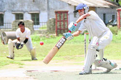 A batsman takes a stance to hit the ball in the Uttarakhand Challenger Cup Cricket Tournament in Dehradun on Thursday. 