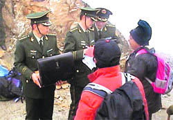 @@@@Chinese Army personnel check documents of Kailash Mansarovar pilgrims on the Lipulekh Pass.