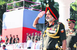 Lt-Gen RS Sujlana, Commandant, Indian Military Academy, takes salute at commandants parade in Dehradun on Thursday. 