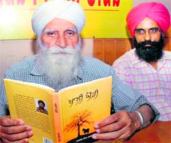 Jaswant Singh Kanwal (with a book) and Jasbir Singh Sheeri, another Punjabi writer, in Jalandhar on Thursday