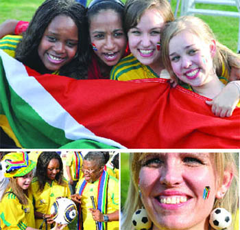 South African football fans celebrate as they watch the opening of the World Cup 2010 at the South African High Commissioner's residence in New Delhi on Friday.