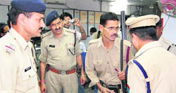 Police officials check security at a bank in Dehradun on Thursday.