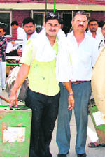 Officials with poll material at Fatehabad on Friday.