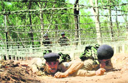 CRPF troops get training as part of the Battle Obstacle and Assault Course (BOAC) at Bantalab in Jammu on Friday.
