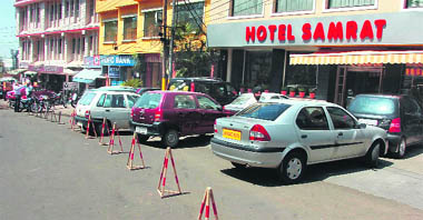 and encroachments on a road by hotels and commercial houses near the JMC office in the Gumat area in Jammu. 