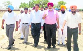 A delegation of engineers from 13 districts of Punjab examines the project of renovation of a pond at Detwal village