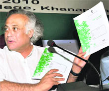 Union Environment and Forests Minister Jairam Ramesh releases a booklet during the Green India National Mission meet in Guwahati on Friday.