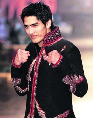RING TO RAMP: Vijender Singh displays a creation by designer Rohit Bal in the HDIL India Couture Week in Mumbai in 2008