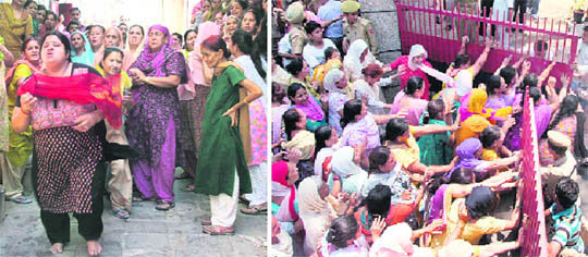 The grief-stricken mother of Shalin Gupta runs towards his body when it was brought at Nai Basti in Jammu on Saturday; and (right) protesting women try to barge into Gandhi Nagar police station