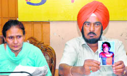 Retired DSP Piara Singh addresses a press conference in Jalandhar on Saturday. His wife, Jasbir Kaur, is seated next to him.