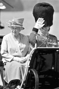 Britain Queen Elizabeth II rides in an open horse-drawn carriage to the Horse Guards Parade for Trooping the Colour ceremony, to mark her official birthday in London