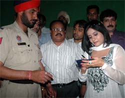 A police man taking autograph from Punjabi singer-turned- actress Miss Pooja, who was in Bathinda to promote her film Punjaban on Sunday