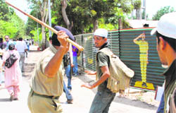 A candidate for the written examination of the Indo-Tibetan Border Police (ITBP) seems to be asking this question to a cop, set to hit him with a lathi, in Chandigarh on Sunday. 