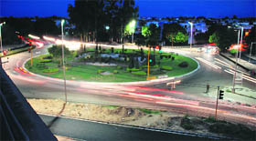 Whirl of Lights: Headlights of moving vehicles create a beautiful pattern as they go around a roundabout in Chandigarh on Sunday