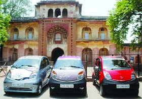 Tata Nano cars reach the Safdarjung Tomb in New Delhi on Sunday after covering 15,000-km distance across India