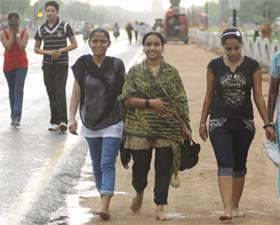 Youngsters enjoy the rain which followed the dust storm