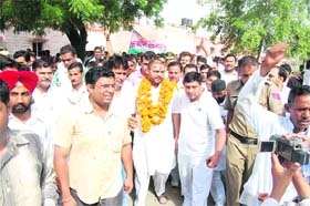 Ashok Tanwar with his supporters at the Sirsa railway station