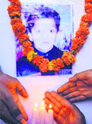 Members of the Jammu youth wing pay tributes to Shalin Gupta in Jammu on Sunday.