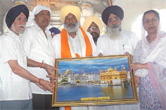 Balwinder Singh Bhundar (centre) being honoured at a function organised to felicitate him after his election to the Rajya Sabha at the Haji Ratan Gurdwara in Bathinda on Monday.