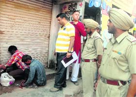 Illegally-run chemist shops being sealed at Hallo Majra in Chandigarh