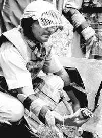 One of the policemen shows the hand grenade found in the Kharak Mangoli area near Majri Chowk in Panchkula