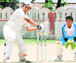 A match in progress at the Second Basudev Raghav Memorial Cricket Tournament at the Survey Grounds