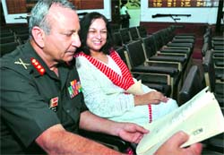 Lieut-Gen Deepak Raj shows his wife his record as a gentlman cadet of the IMA during the reunion of the 1971 batchmates of the academy 