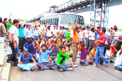 ETT teachers stage dharna on Sutlej River in Ropar on Monday.