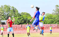 A player heads the ball during a match of the Dehradun Football League played at the Police Lines Ground in Dehradun
