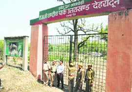 Officials lock the gates of the Rajaji National Park for the monsoon period 