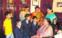 Uttarakhand Governor Margaret Alva interacts with schoolchildren at the Raj Bhawan in Nainital