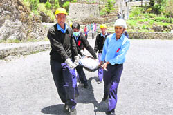 Students participate in a mock drill on disaster management in Mussoorie