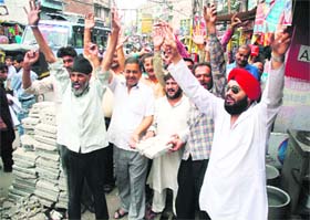 Shopkeepers of Below Gummat area hold a protest against the Municipal Corporation in Jammu