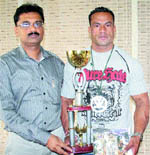 Dharmendra Singh with Mr Europe trophy