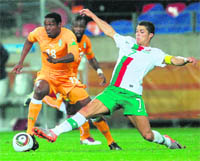 Ivory Coasts striker Kader Keita (L) being challenged by Portugals Cristiano Ronaldo in Port Elizabeth on Tuesday.