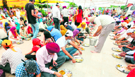 A langar being served on the occasion of the martydom of Guru Arjan Dev at a gurdwara in Sector 34, Chandigarh,