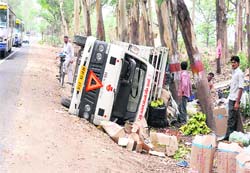 An overturned truck on the Haridwar-Delhi national highway in Haridwar on Wednesday.