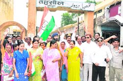 Congress activists hold a protest in Haridwar on Wednesday. 