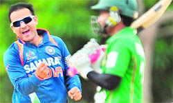 Virender Sehwag celebrates the dismissal of Bangladeshi cricketer Mushfiqur Rahim during the second ODI of the Asia Cup in Dambulla on Wednesday.