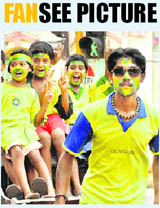 Brazil fans in Kolkata ride a hand-pulled rickshaw to celebrate the win of Brazil over North Korea on Wednesday.
