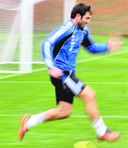 Greeces captain Giorgos Karagounis warms up during a training session in Durban