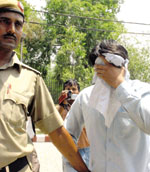 The accused school clerk at a local court in New Delhi