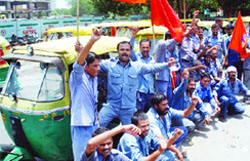 Auto drivers protest against the Delhi government, at New Delhi railway station 